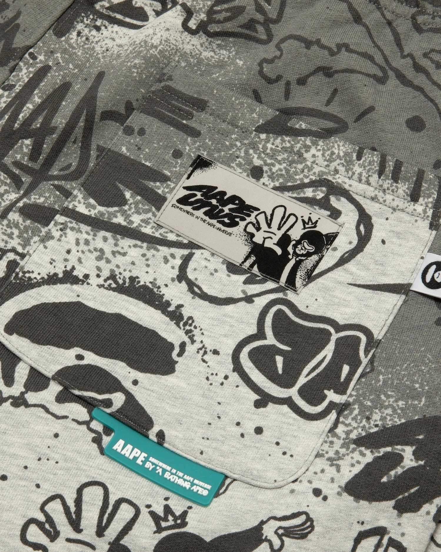 AAPEUNVS graffiti print sweat pants